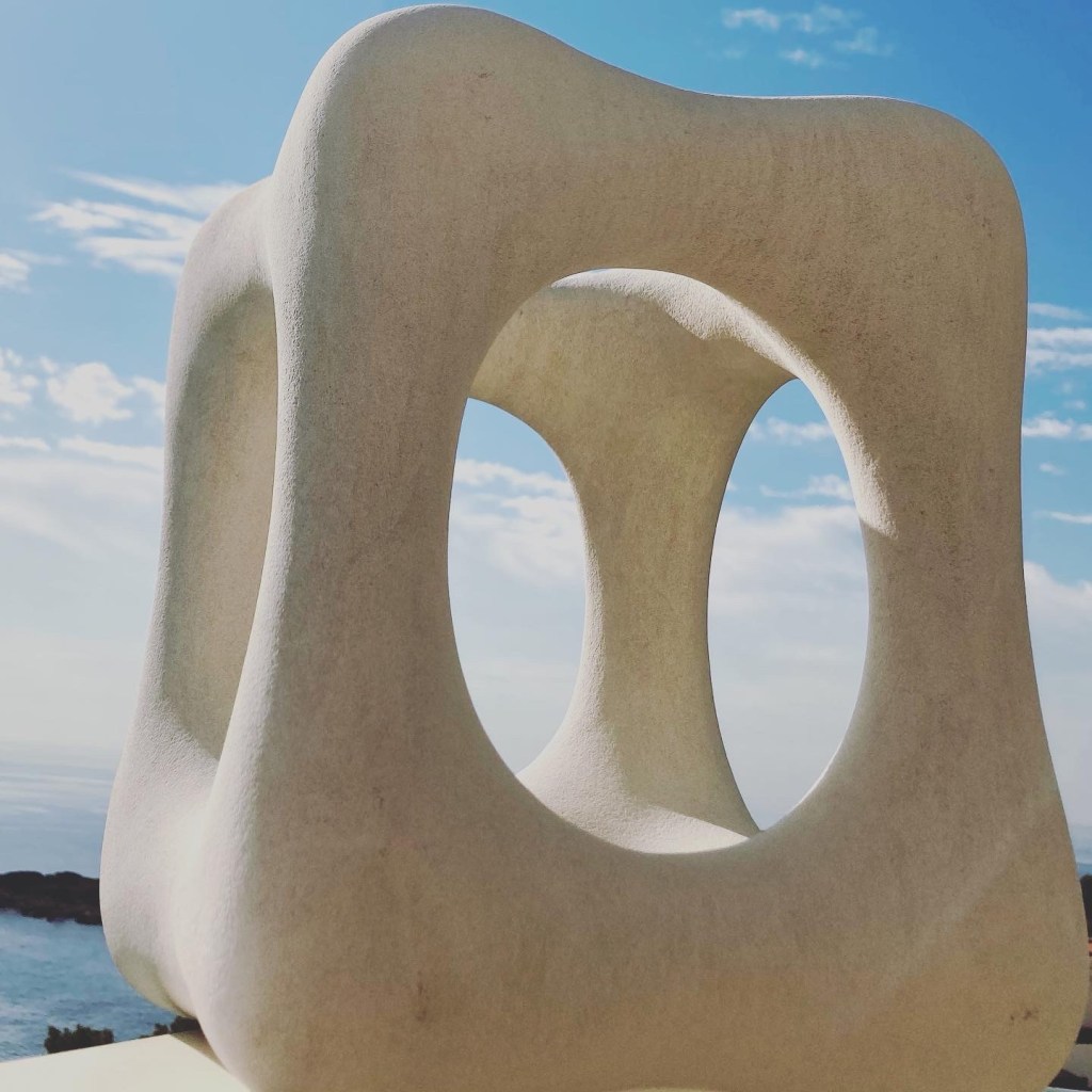Hand-Stone Sculpture by Manuela Stoerzer "Transcending Duality" This piece reflects the two sides of the coin in one piece: heavy and light, square and round, solid and shine-through Context: Personal Growth, Spiritual Development, Natural Transformation.